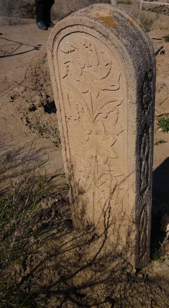Tomb stone aka Kulpytas at the cemetery of Mizdakhan, Khodjeyli,