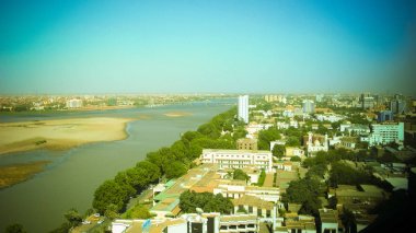 Aerial panoramic view to Khartoum, Omdurman and confluence of the Blue and White Niles in Sudan clipart