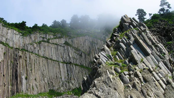 Pilar Rocks of Stolbchatiy cape in Kunashir at Kuril islands, Russia — Fotografia de Stock