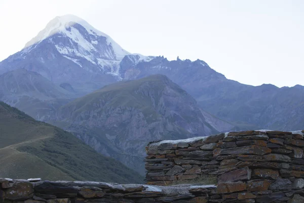 Mount Kazbek rises above the walls of the ancient Orthodox monas