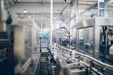 Robotic factory line water bottled into canisters clipart