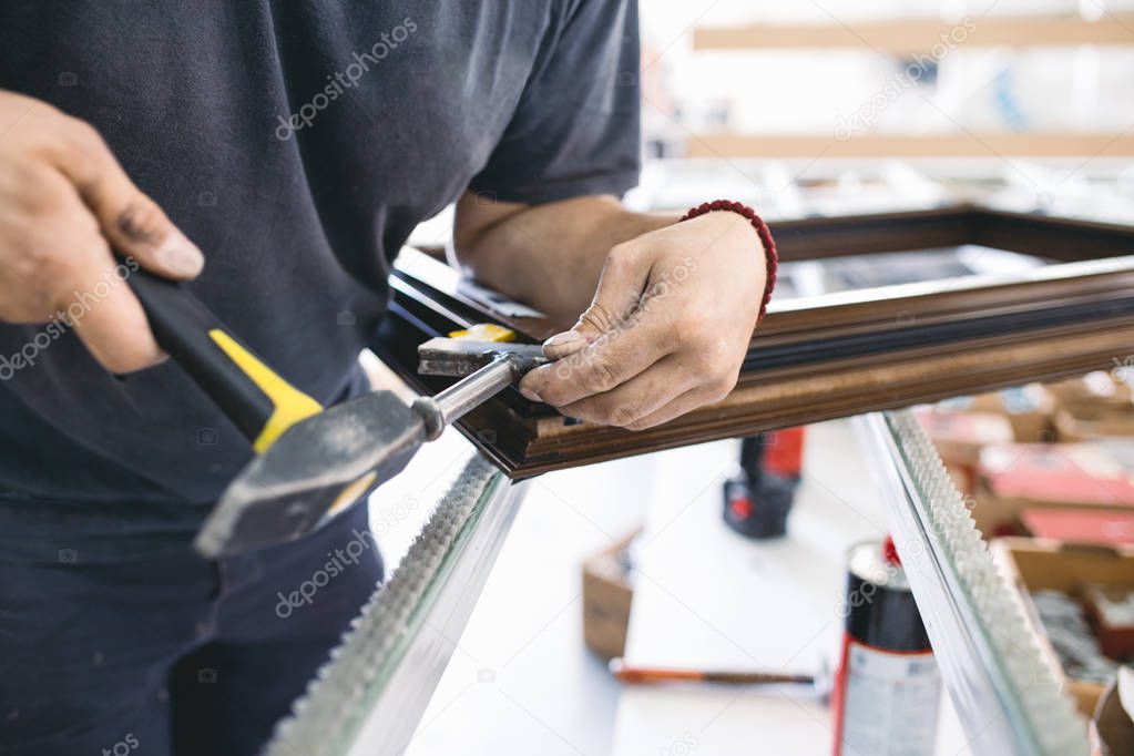 Manual worker assembling PVC doors and windows