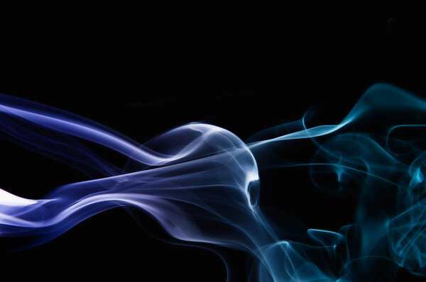 Abstract blue and purple smoke on black background