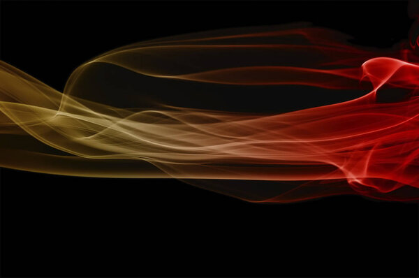 Abstract yellow and red smoke on black background