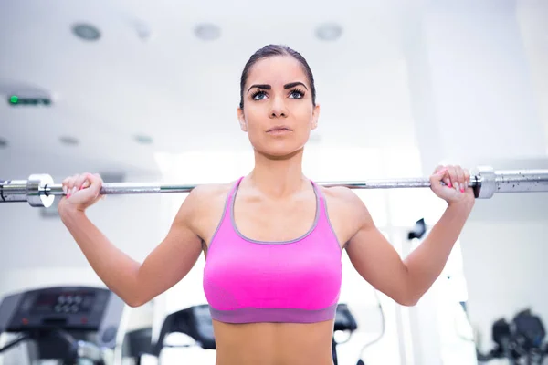 Woman doing exercises at gym — Stock Photo, Image