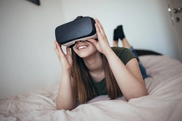 Young woman in virtual reality glasses