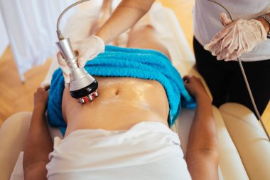 Cavitation RF body treatment and contemporary medicine for health beauty improvement and fat and cellulite removal clipart
