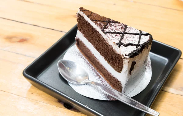 Closeup Chocolate milk cake on wood table background, selective  focus — Stock Photo, Image