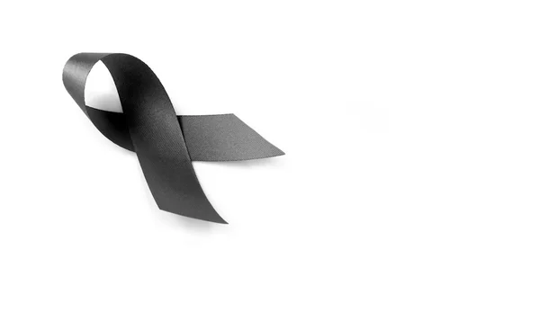 Black ribbon symbol for mourning on white background — Stock Photo, Image