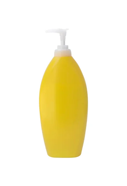 Botella cosmética amarilla con bomba sobre aislado sobre fondo blanco —  Fotos de Stock
