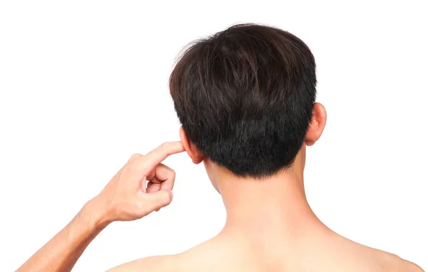 Man scratching an itch ear with finger on white background, heal — Stock Photo, Image