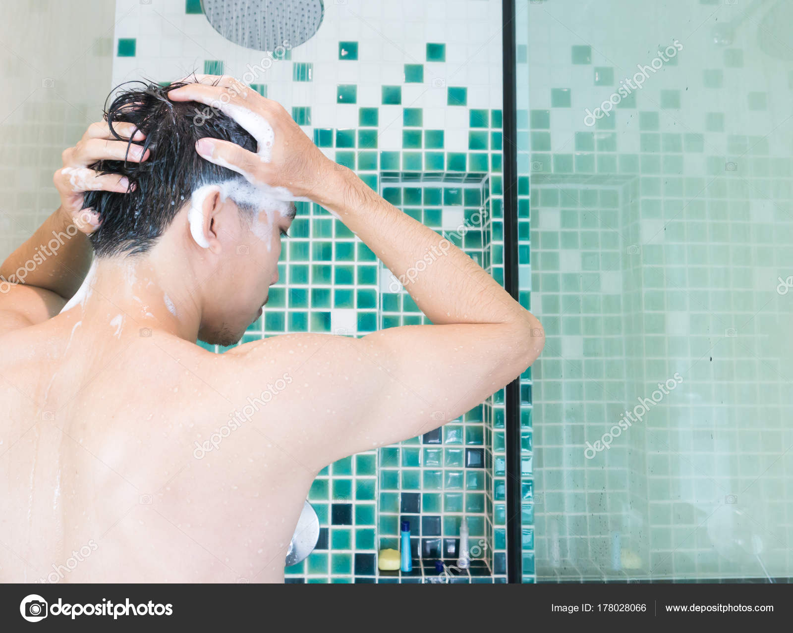 Closeup men washing hair and taking a shower in the bathroom, health care and medical concept