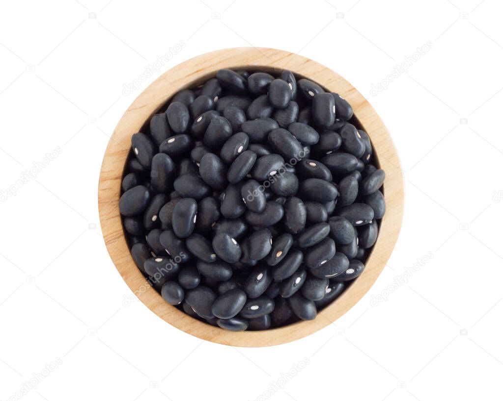 Closeup black beans seeds in wooden bowl on white background, healthy food concept