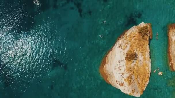 Aerial shot of sea waves and cliff. Sveti Nikola Island rock coast drone footage — Stock Video