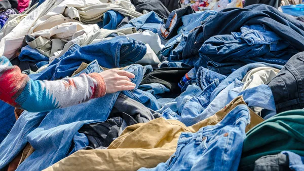 Heaps of clothing on the second hand market