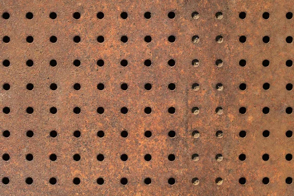 Rusty iron background with holes — Stock Photo, Image