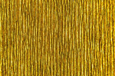 Kabarık kağıt altın doku. Altın kağıt doku arka plan. Arka plan doku oluklu kağıt derin yivli. Desen dikey oluklar