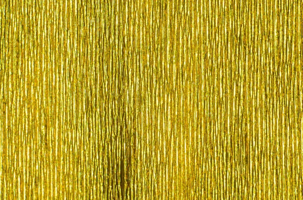 Kabarık kağıt altın doku. Altın kağıt doku arka plan. Arka plan doku oluklu kağıt derin yivli. Desen dikey oluklar