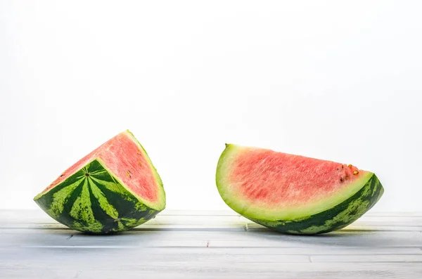 Two pieces of fresh watermelon on white table — Stock Photo, Image