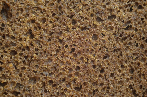 Kepekli ekmek doku. Çavdar ekmeği arka plan yakın çekim.