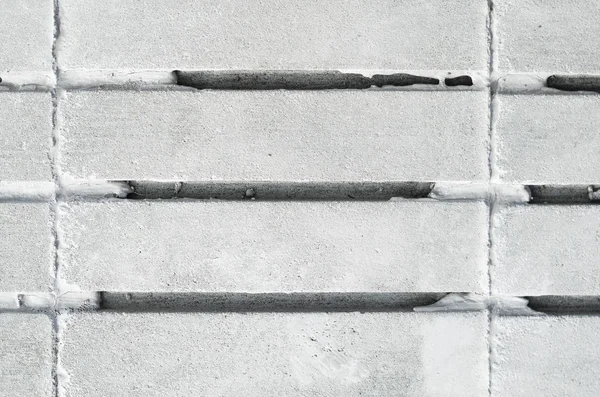 Beton döşeme parke ve paralel oluklar ile bitirmek için. Yapı malzemesi, doku