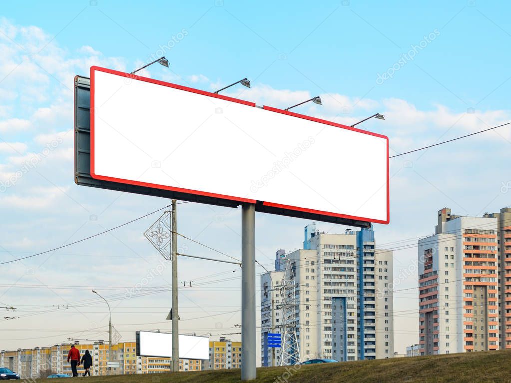 Blank white billboard on background with multi story buildings, walking peoples and passing cars, mockup