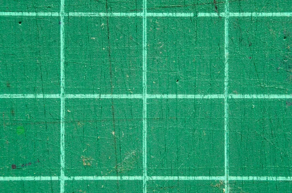 Texture of green scratched cutting mat.