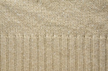 Örme kazak örgü iki tür bej doku. Arka plan olarak örgü doku.