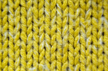 Sarı örgü doku yakın çekim. Örgü kazak boş geçmiş