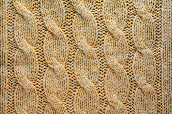 Knit Texture of Beige Wool Knitted Fabric with Cable Knits Pattern. Blank Background