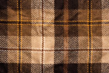 Kahverengi kumaşı kontrol etti. İskoç yünü. Kapat.