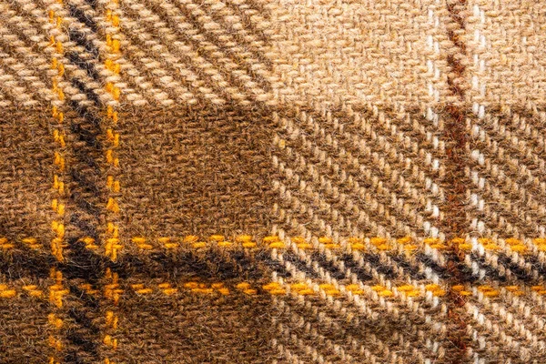 Brown checked fabric. Scottish wool. Close up