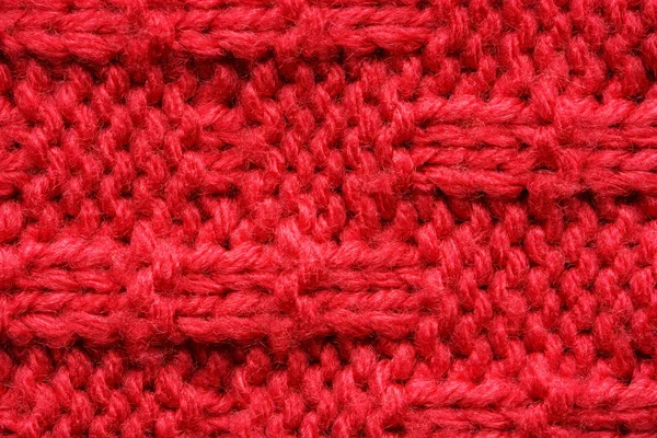 Tekstura dzianego swetra. Czerwony wzór. — Zdjęcie stockowe