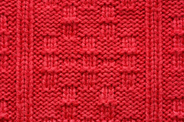 Die Textur eines Strickpullovers. rotes Muster. — Stockfoto