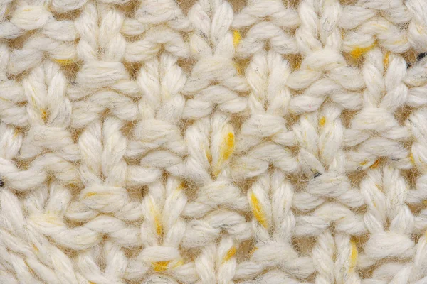 A textura de um suéter de malha bege — Fotografia de Stock