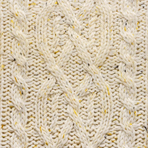 La texture d'un pull tricoté beige . — Photo