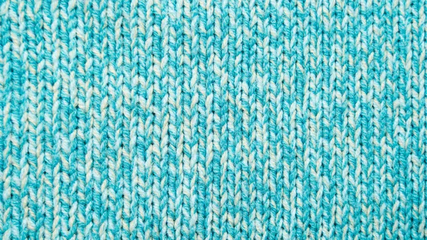 La texture d'un tricot bleu turquoise — Photo