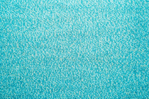 Die Textur eines blauen türkisfarbenen Strickstoffs lizenzfreie Stockfotos