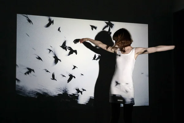 Abstract portrait of a beautiful girl in the light of the projector — Stock Photo, Image