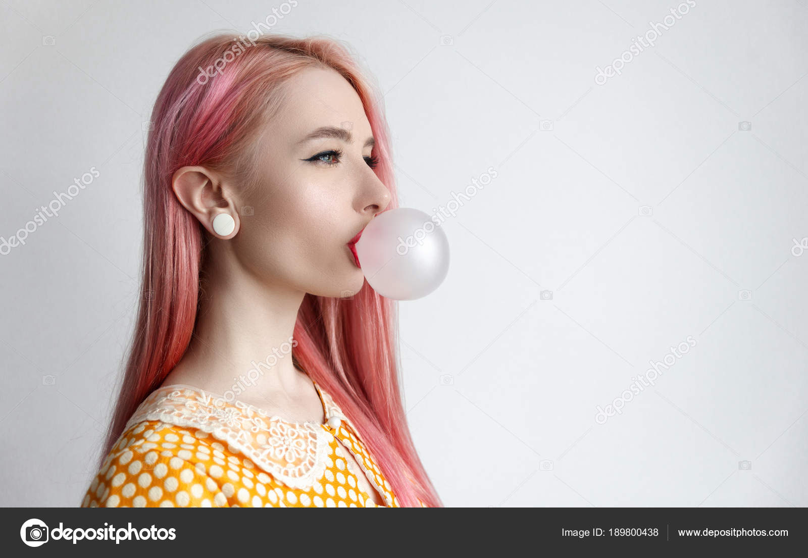 The girl with the pink hair is blowing bubble gum Stock Photo by ©AlexHulko 189800438 The girl with the pink hair is blowing bubble gum Stock Photo by ©AlexHulko 189800438