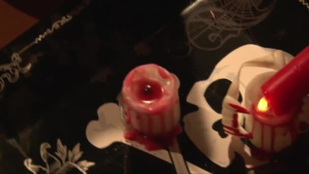 Top view  melting red wax on white candle, vampire dinner table — Stock Video