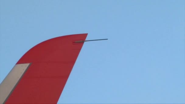 Airplane wing top point closeup shot, plane flying in the blue sky — Stock Video
