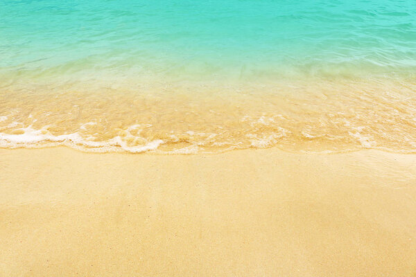 Soft wave on the beach. Summer season on empty tropical beach wi