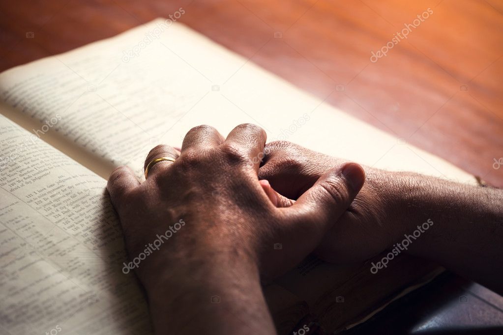 Male hands on a Book