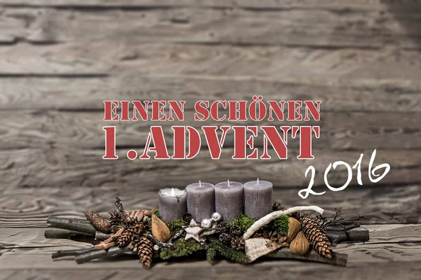 Merry Christmas decoration advent 2016 burning grey candle Blurred background text message german 1st