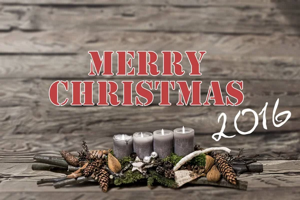 Merry Christmas decoration 2016 burning grey candle Blurred background text message english
