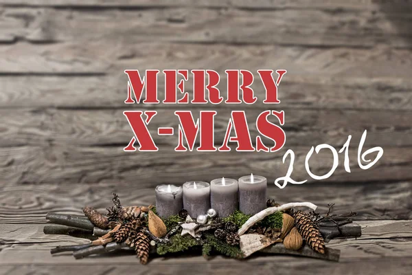 Merry Christmas decoration 2016 burning grey candle Blurred background text message english