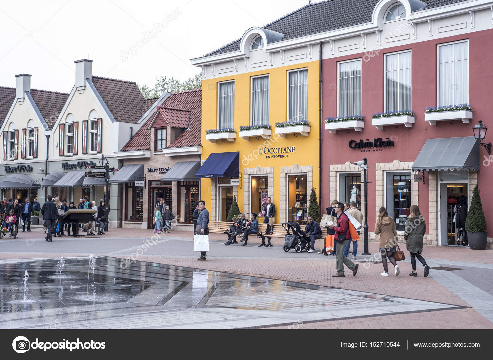 Roermond, Netherlands 07.05.2017 People walking around at the Mc Arthur Glen Designer Outlet ...