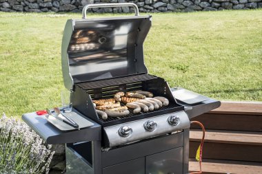 Barbecue grill bbq on propane gas grill steaks bratwurst sausages meat meal clipart