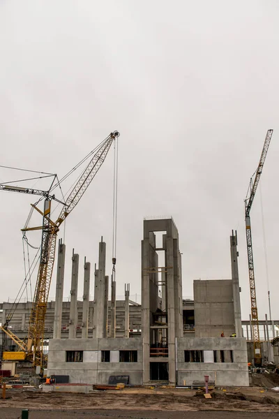 Concrete construction yard building site crane cloudy sky background — Stock Photo, Image